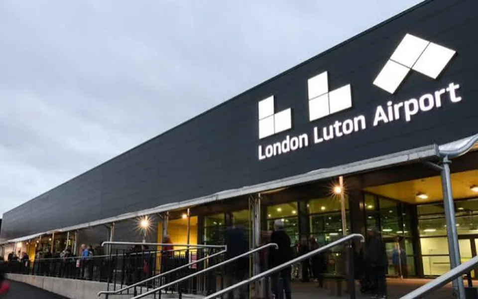London Luton Airport terminal entrance at dusk
